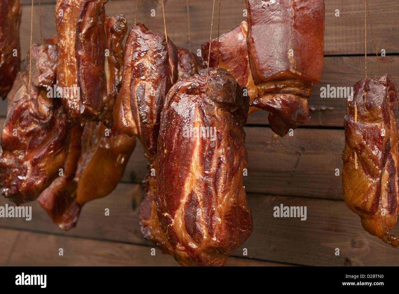 Smoked meat drying in smokehouse, countryside, homemade Stock Photo