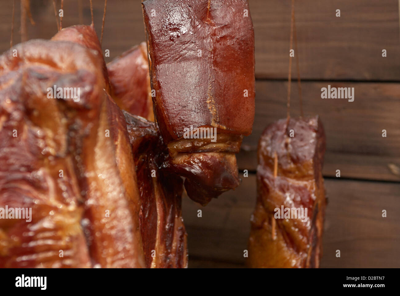 Smoked meat drying in smokehouse, countryside, homemade Stock Photo