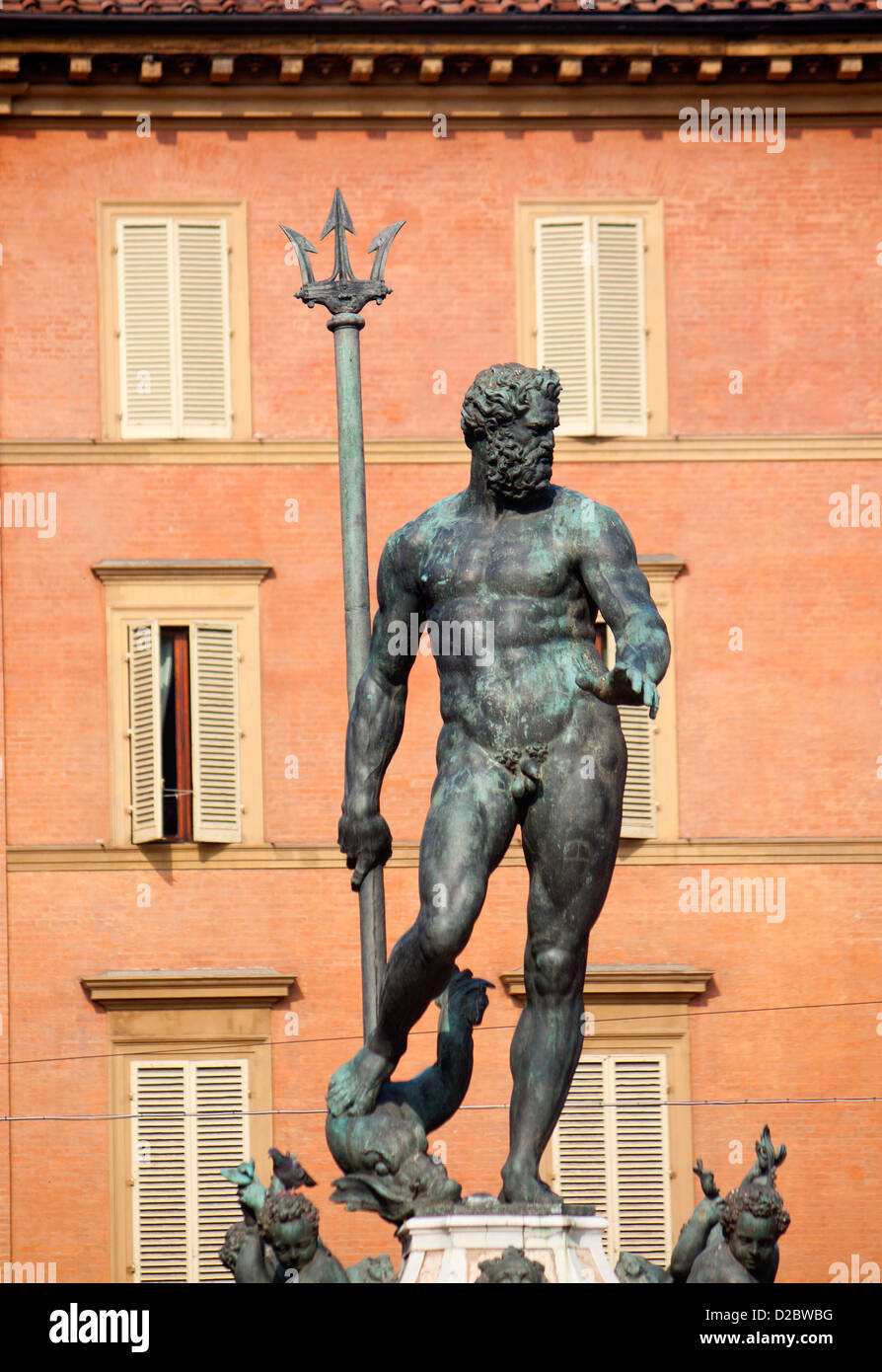 Statue of Neptune with red brick buildings of Piazza Maggiore behind Bologna Emilia Romagna Italy Stock Photo