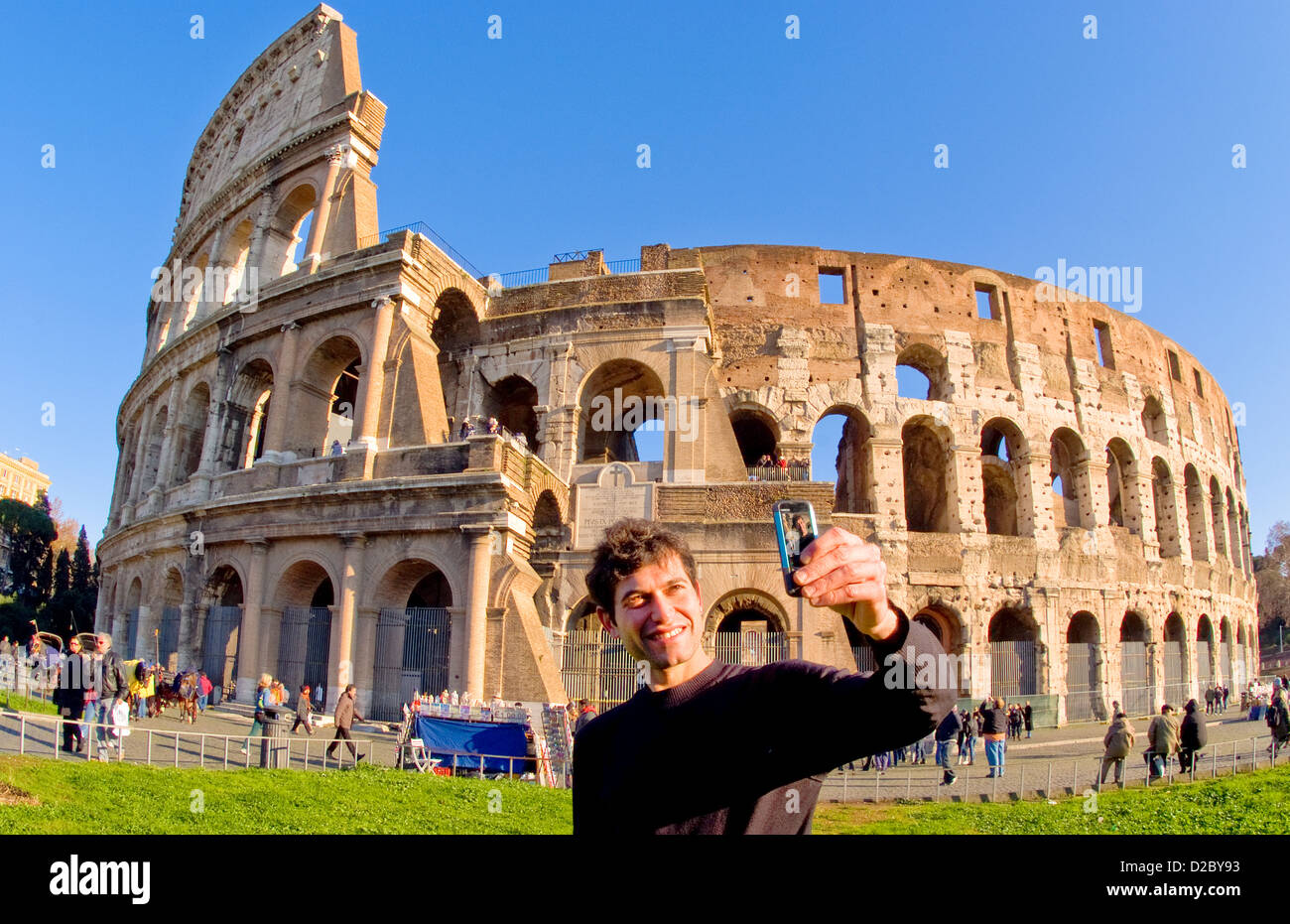 Italian Man Taking Photo At Colosseum, Rome, Italy Stock Photo