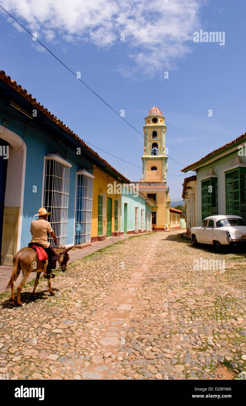 Man Riding Donkey In The Old Colonial City Of Trinidad, Cuba Stock Photo