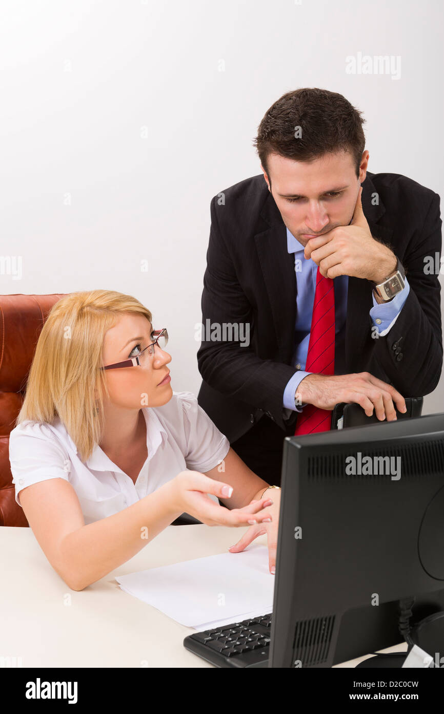 Businesswoman and businessman discussing about difficult business issue at work. Stock Photo