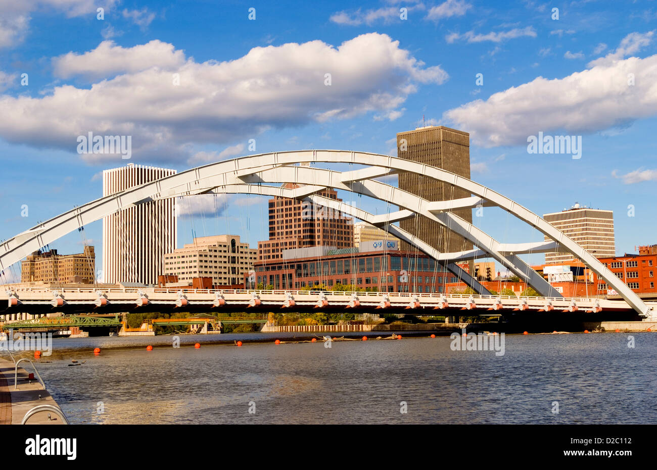 Rochester New York Skyline With The Genesee River And The Susan B. Anthony And Fredrick Douglas Bridge Stock Photo