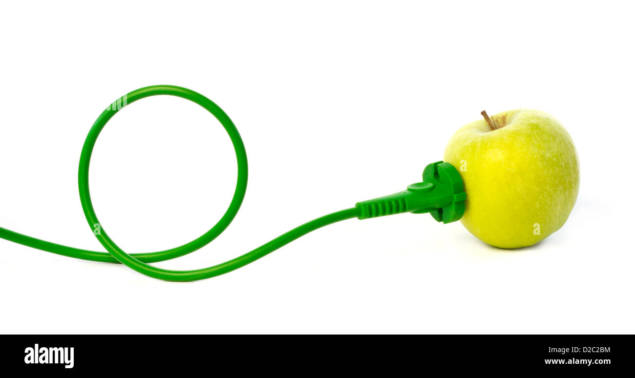 Green power cord plugged into apple outlet against white background Stock Photo
