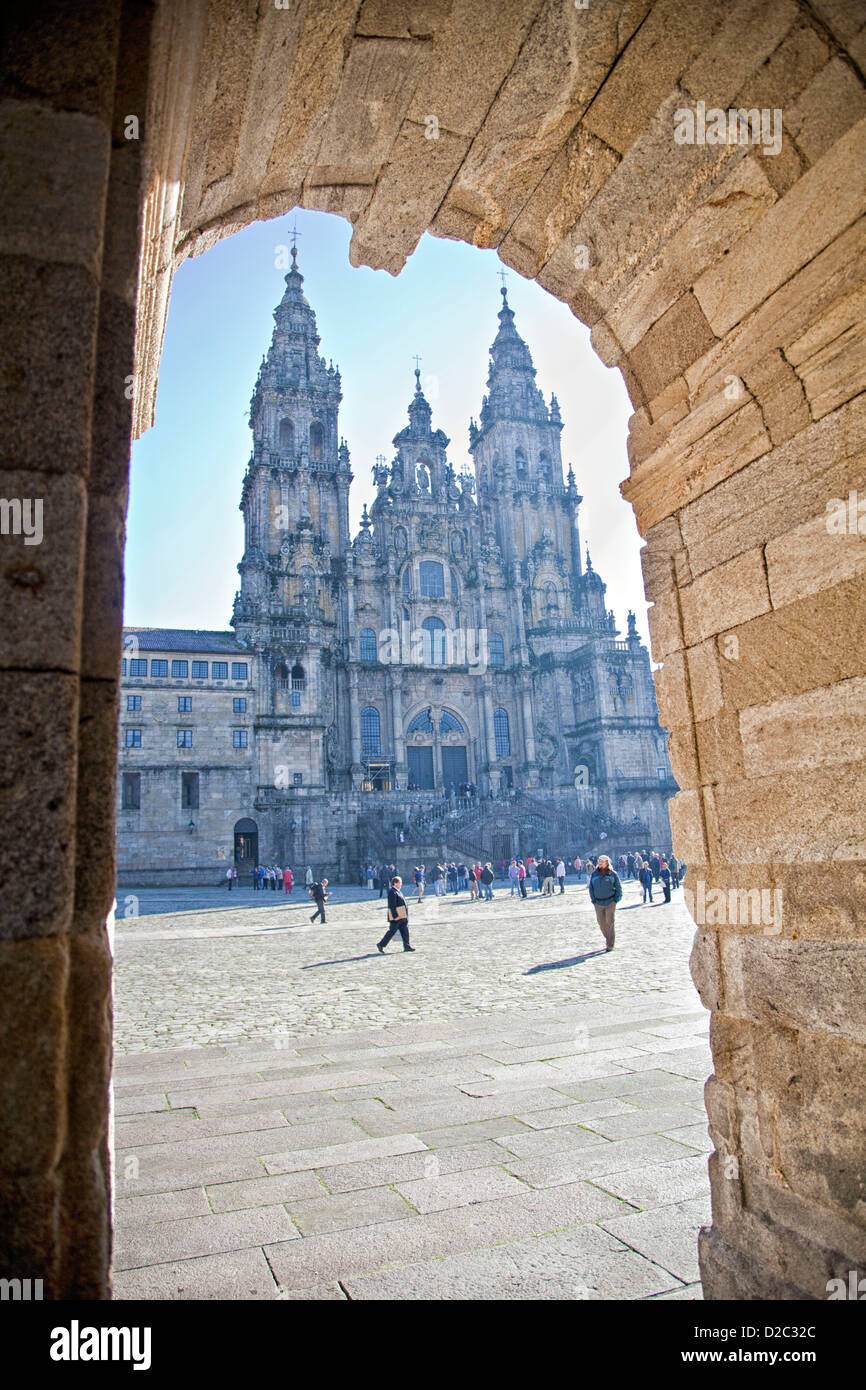 Through the arch we can see the Praza do Obradoiro and the Santiago Cathedral, a tourist attraction and pilgrim destination. Stock Photo