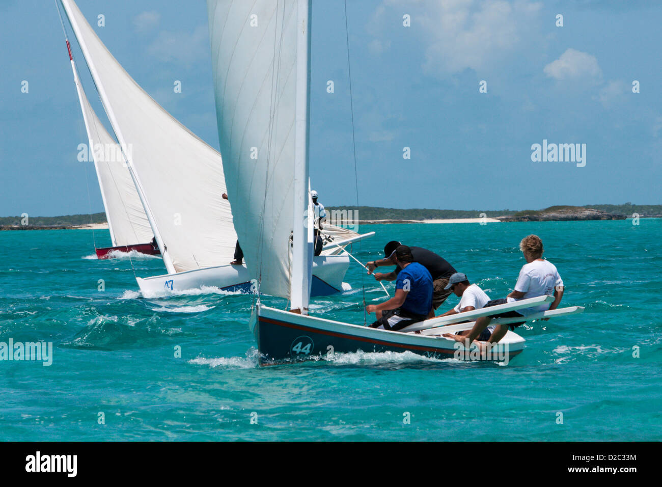 C class Bahamian sloops race in the Black Point regatta, Exumas,Bahamas