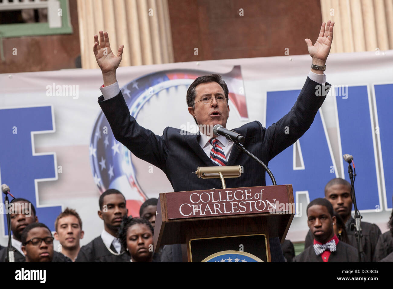 Comedian Stephen Colbert holds a rally with former Republican presidential candidate Herman Cain at the College of Charleston on January 20, 2012 in Charleston, South Carolina. Colbert held the event with Cain, titled Rock Me Like a Herman Cain South Cain-olina Primary Rally, as part of his pseudo-run for president of The United States of South Carolina. Stock Photo