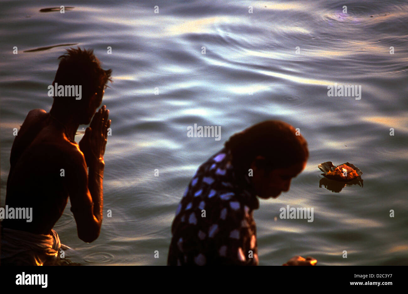 Man Women Bathing Doing Namaskar Prayer Sun Diya Oil Lamp Floating In