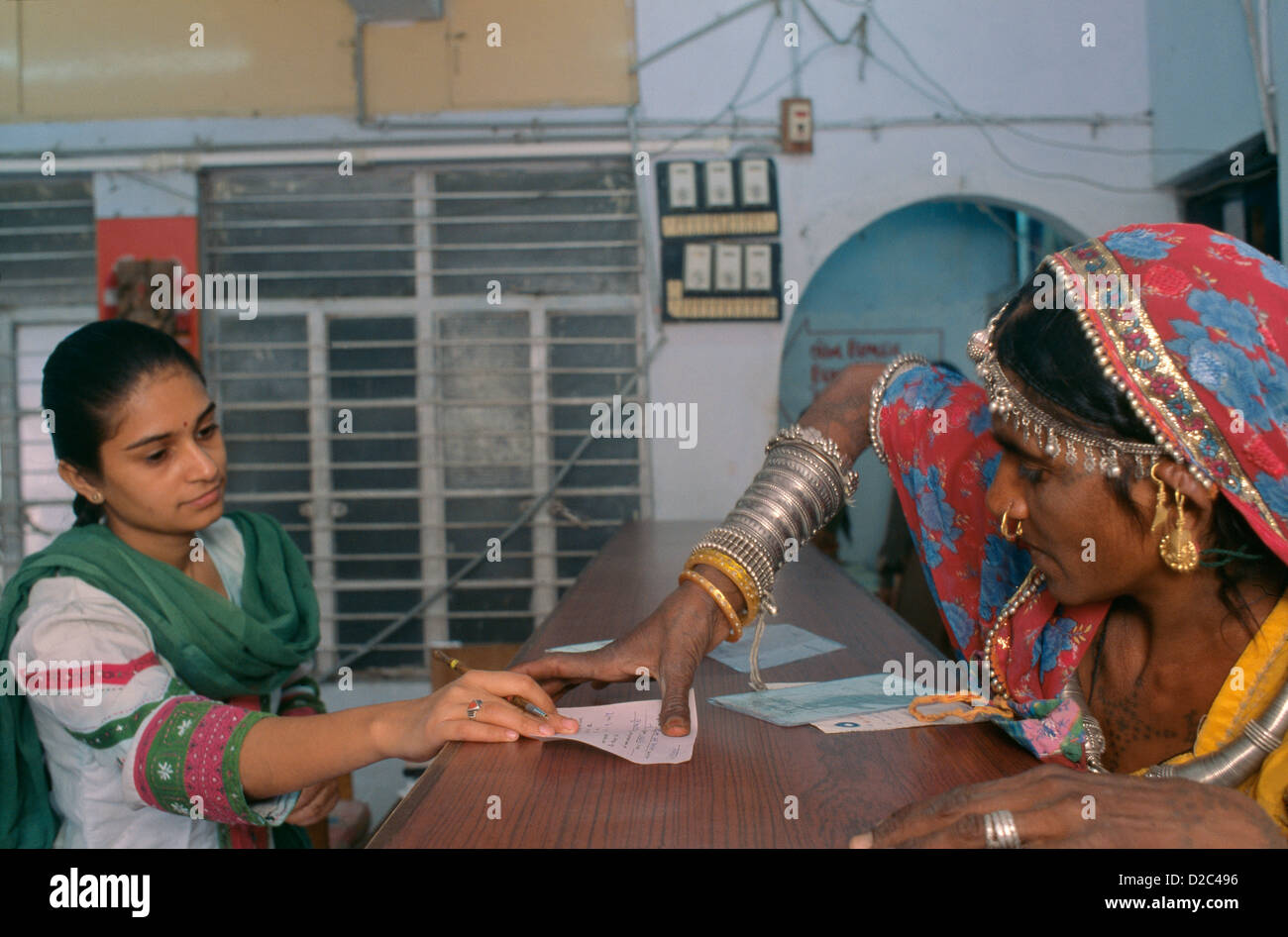Rural Woman Putting A Thumb Impression In A Bank To Open Her Bank Account At Bank, Ahmedabad.India Stock Photo
