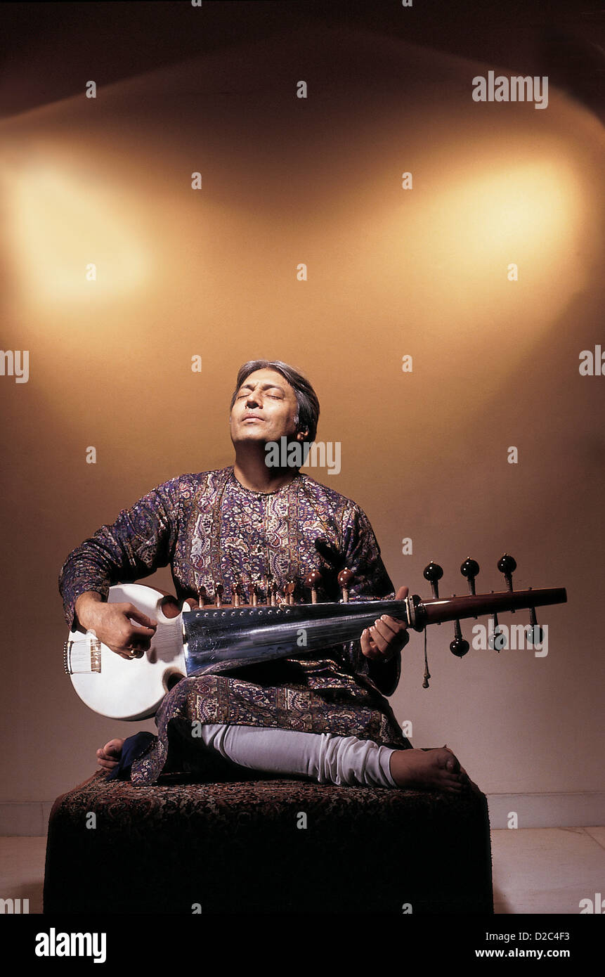 Portrait Of Indian Classical Musician Playing Musical Instrument Sarod