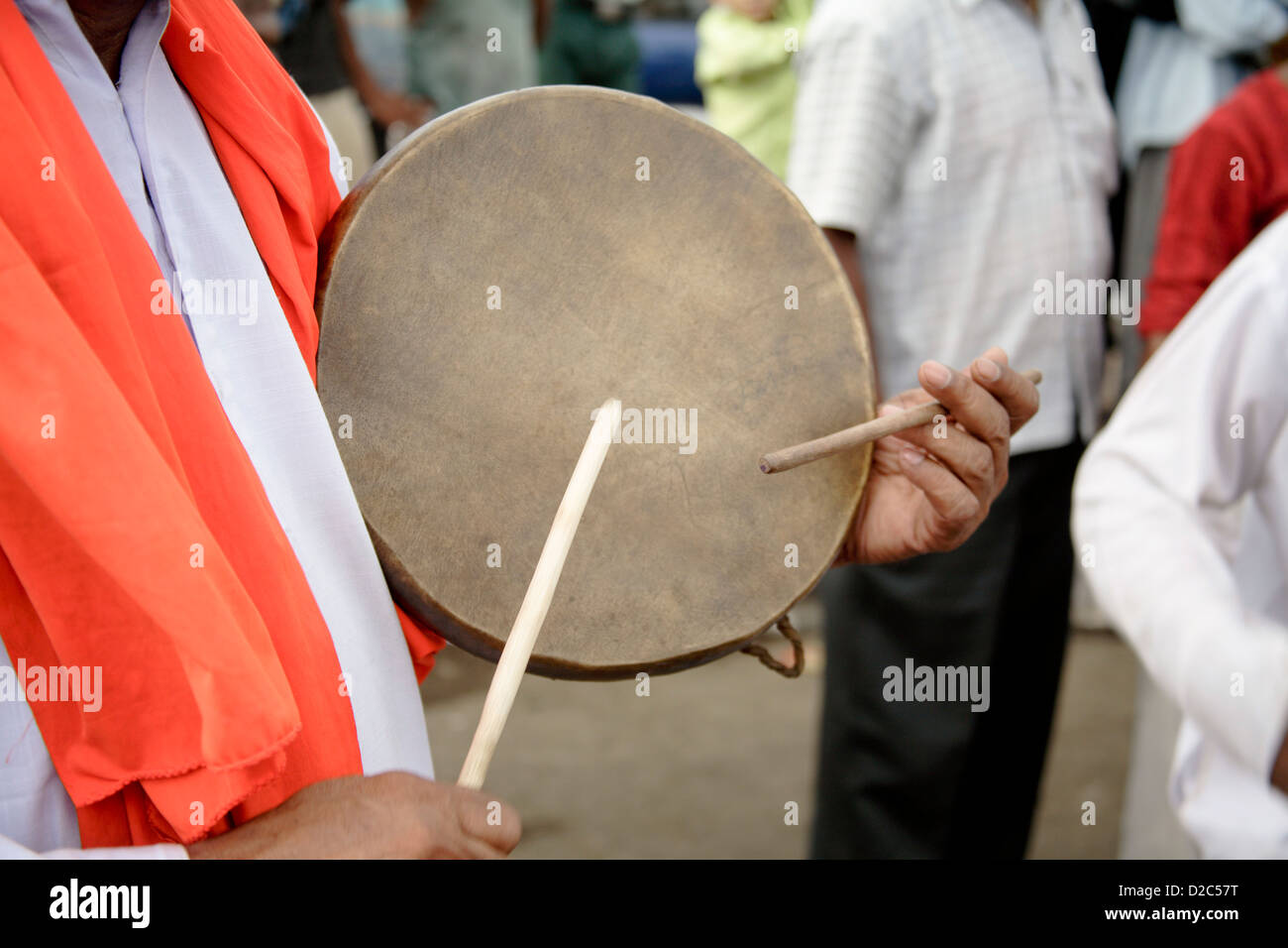 Man Playing Dafli, Hand Drum Played With Two Sticks, India Stock Photo