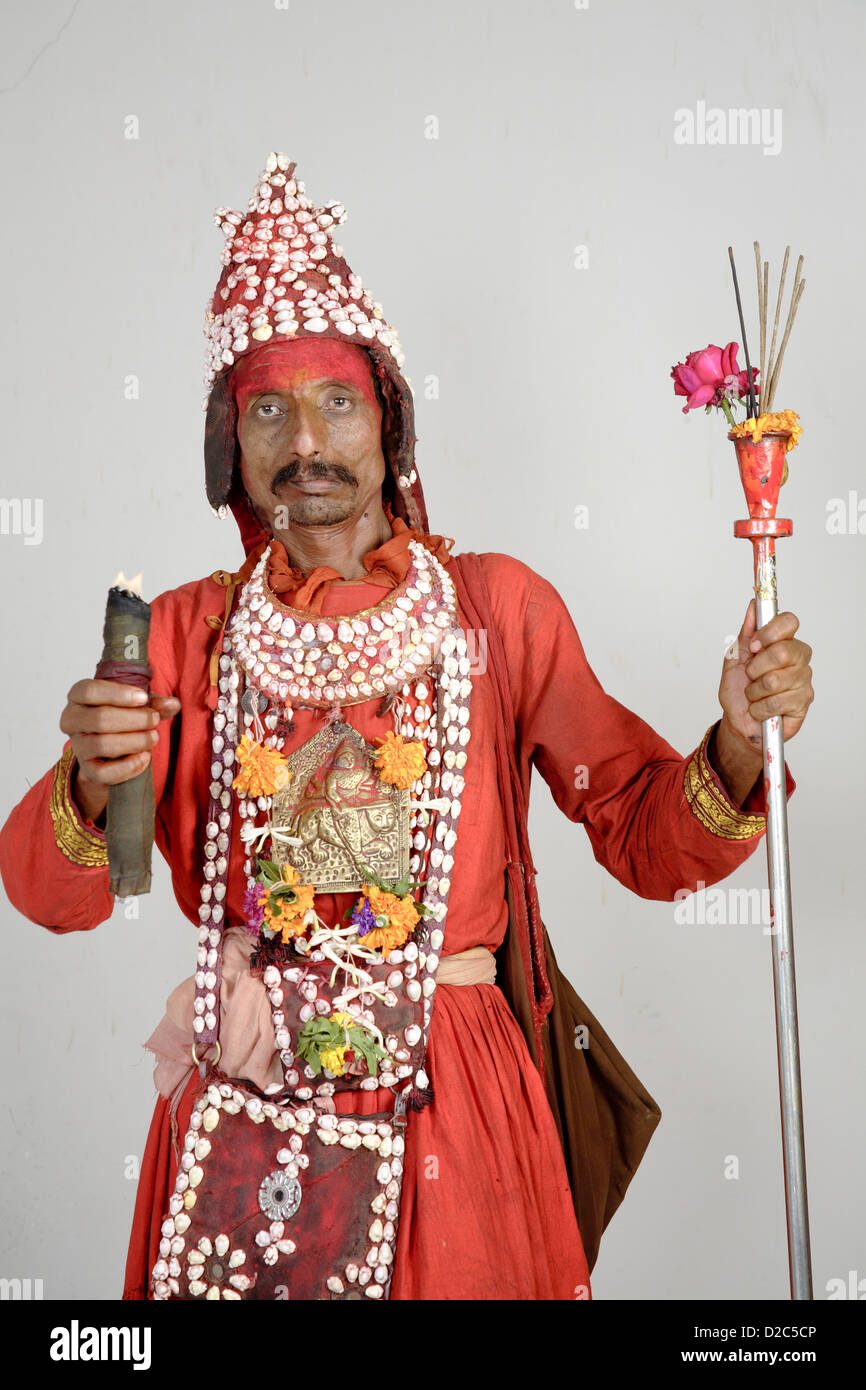 Gondhali From Solapur District Holding Incense Sticks And Divti Or Torch, Maharashtra, India Stock Photo