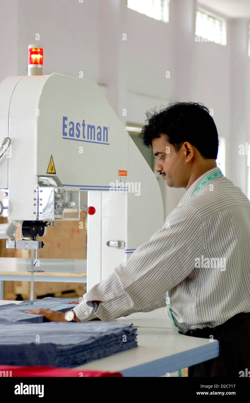 Readymade Garment Factory Interior Man Working On Sewing Machine Suditi Industries At Bombay Mumbai, Maharashtra, India Stock Photo