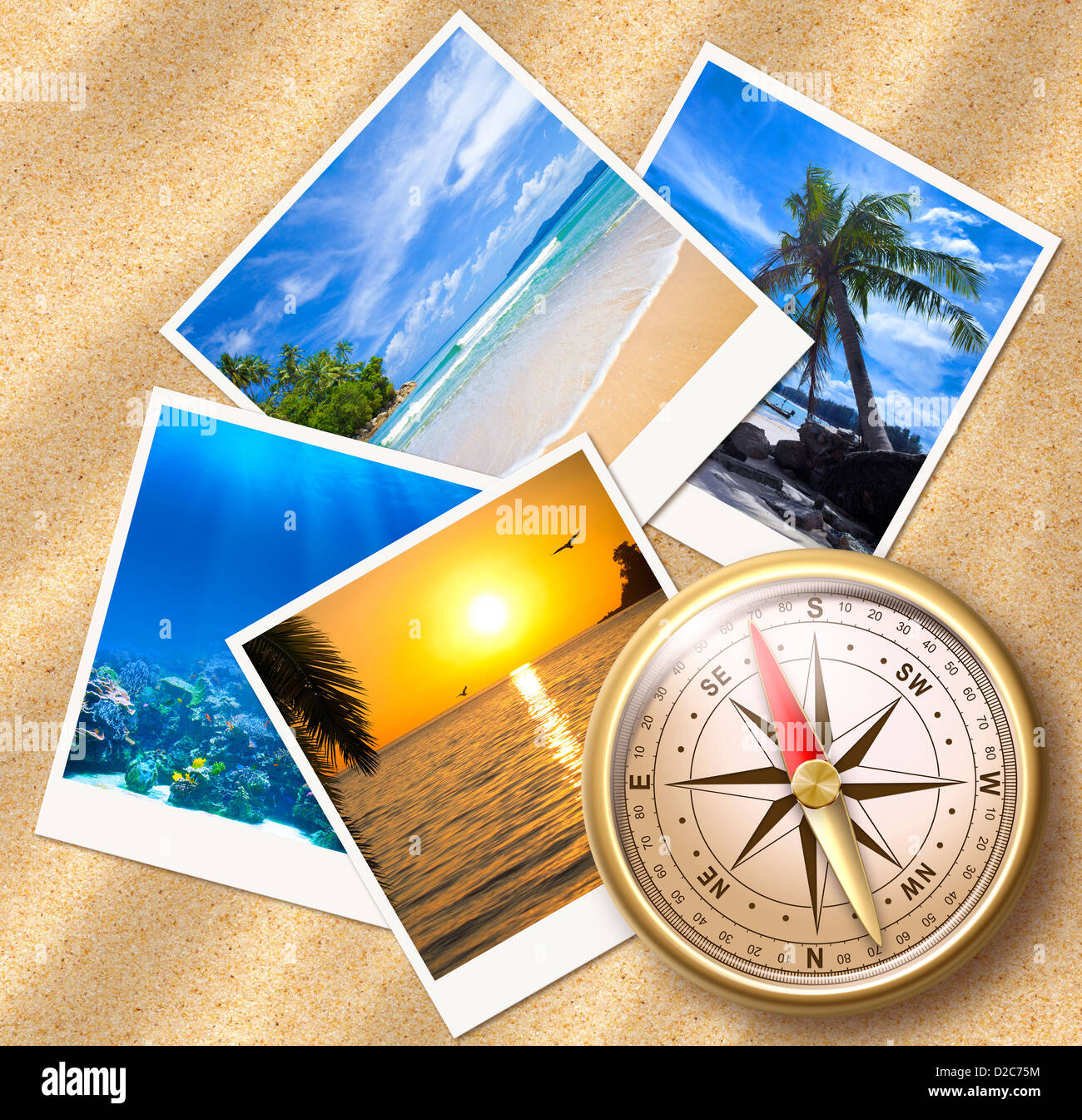 Traveling photos with compass on sand beach Stock Photo
