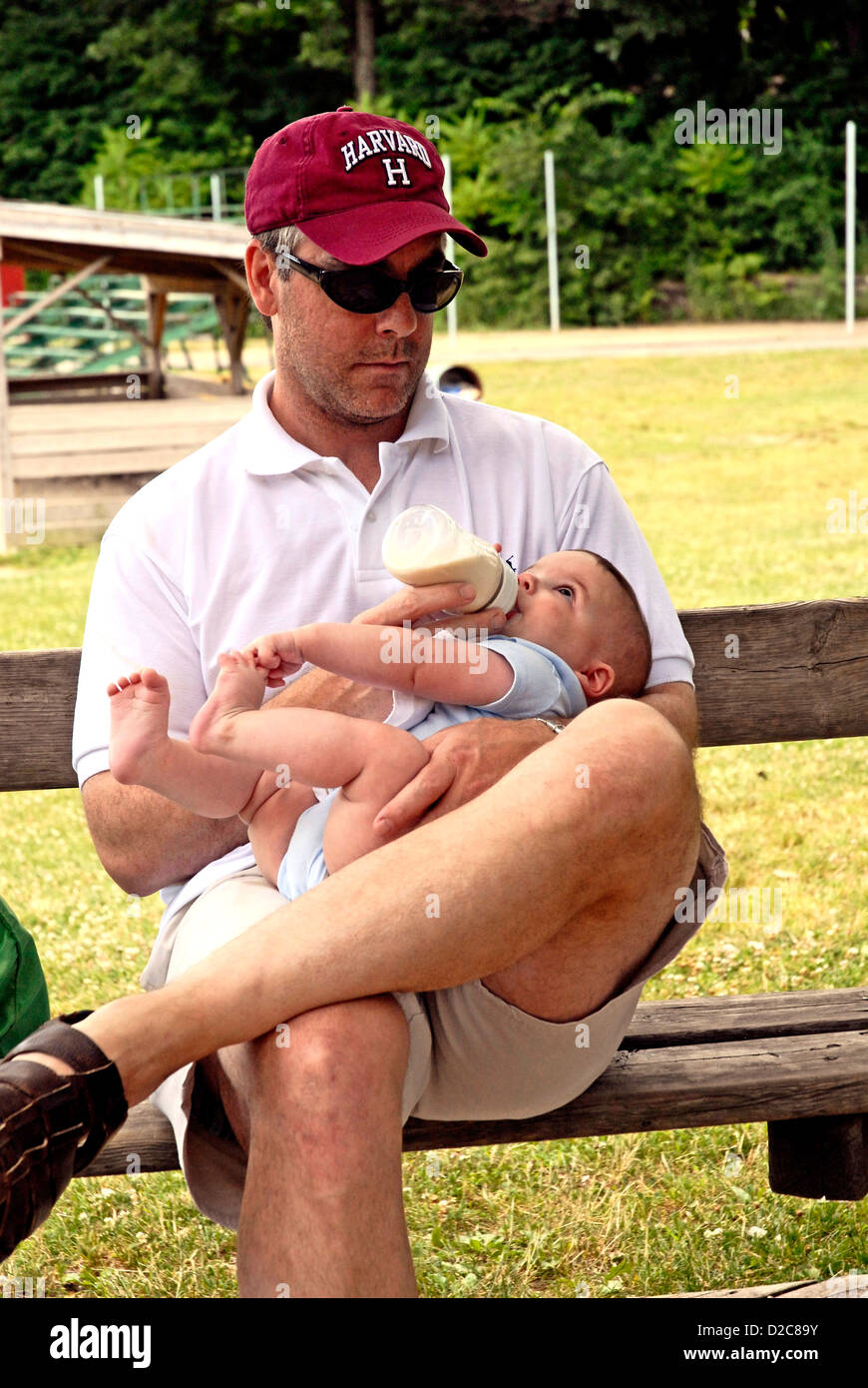 Father Feeding Bottle To 4 1/2 -Month Old Baby Boy, Infant Stock Photo