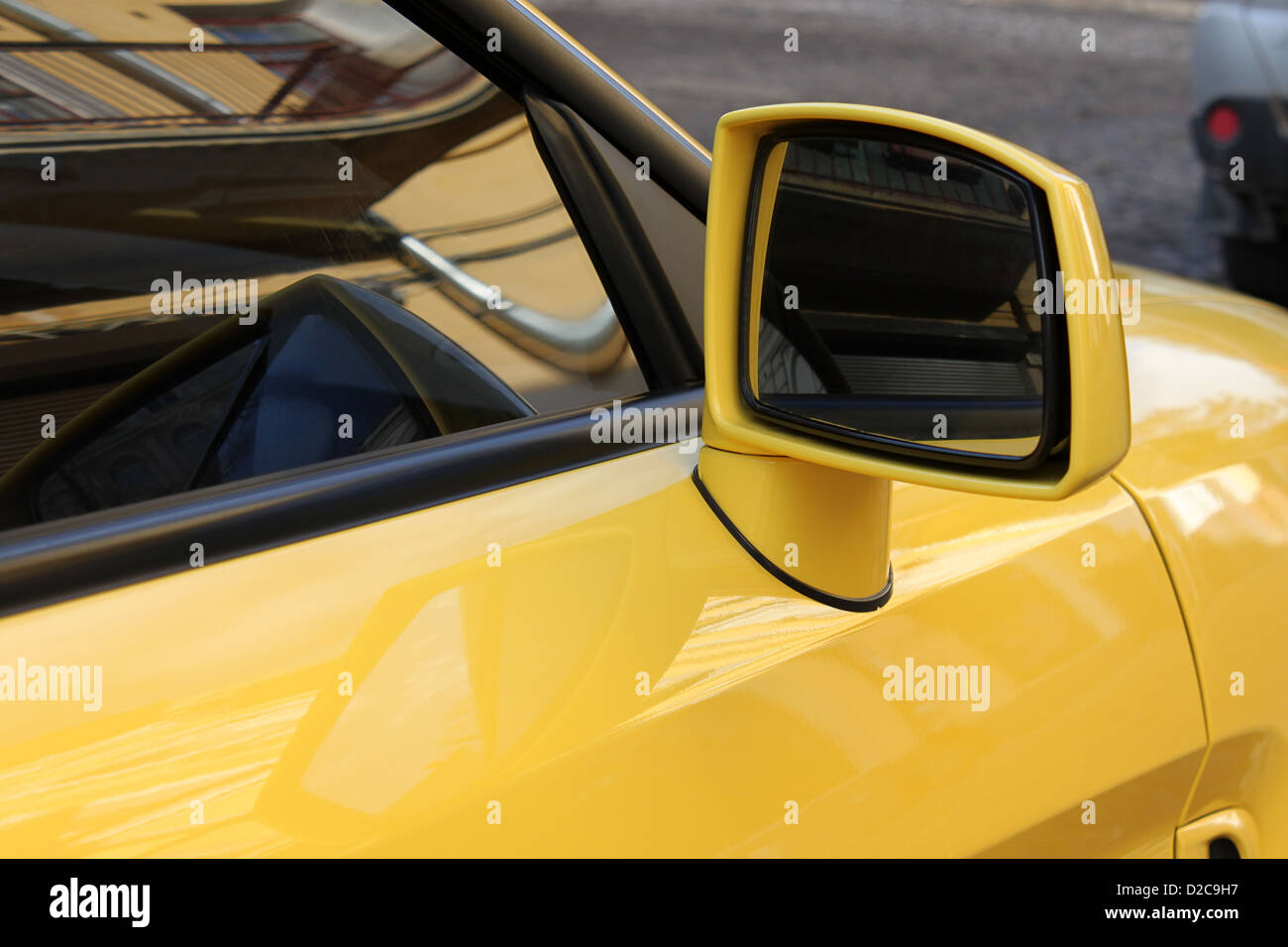 rear view mirror of yellow car Stock Photo Alamy