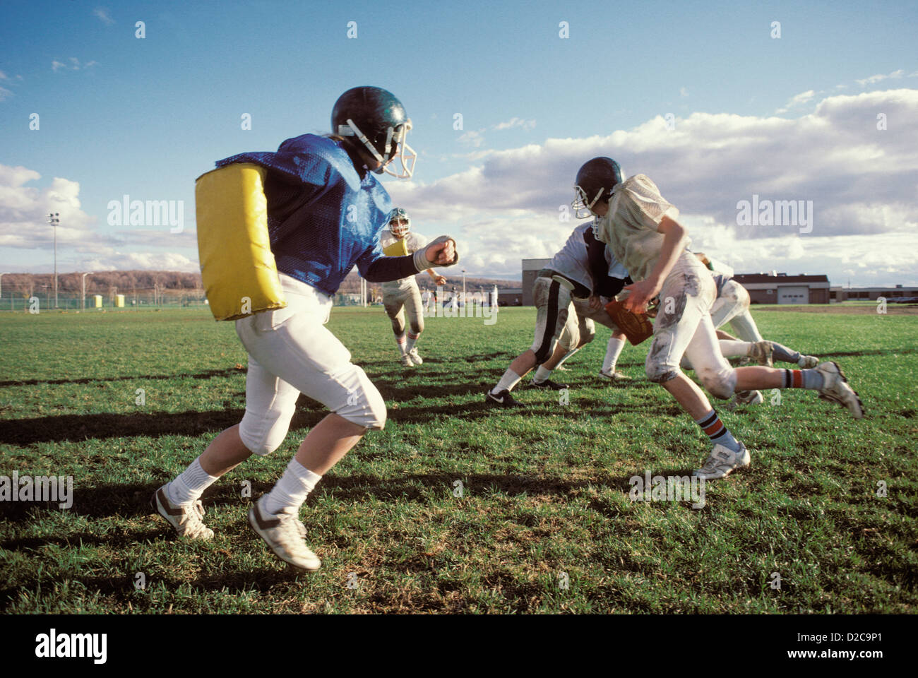 New York, Pioneer Central. Teens Playing Football, With Female Player In Blue Jersey. Stock Photo