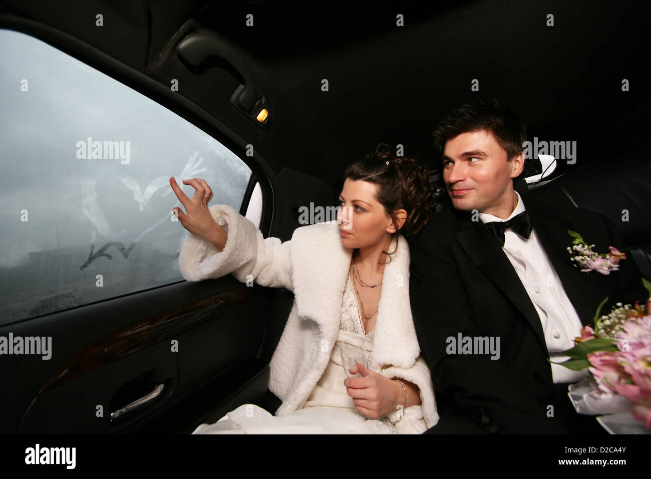 The bride and groom in automobile Stock Photo - Alamy