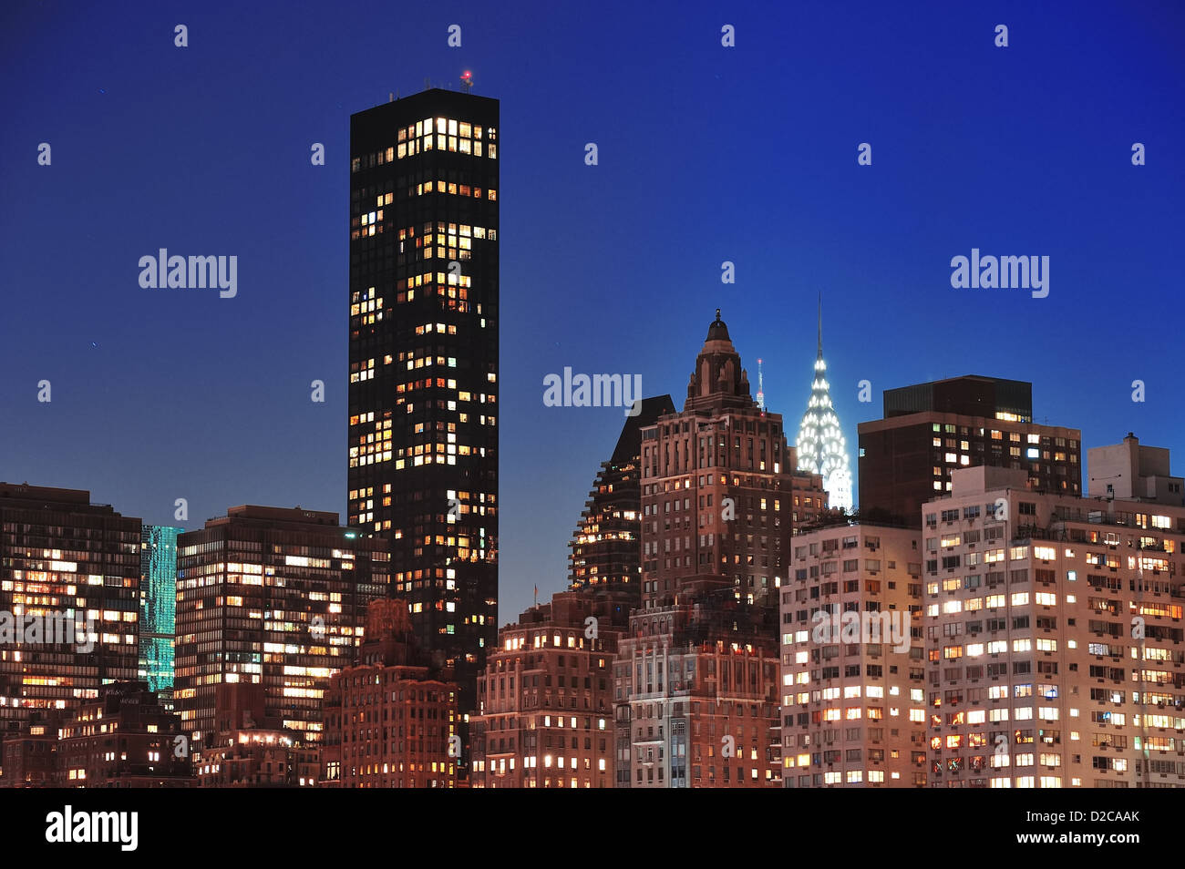 New York City Manhattan midtown skyline at night over East River Stock ...