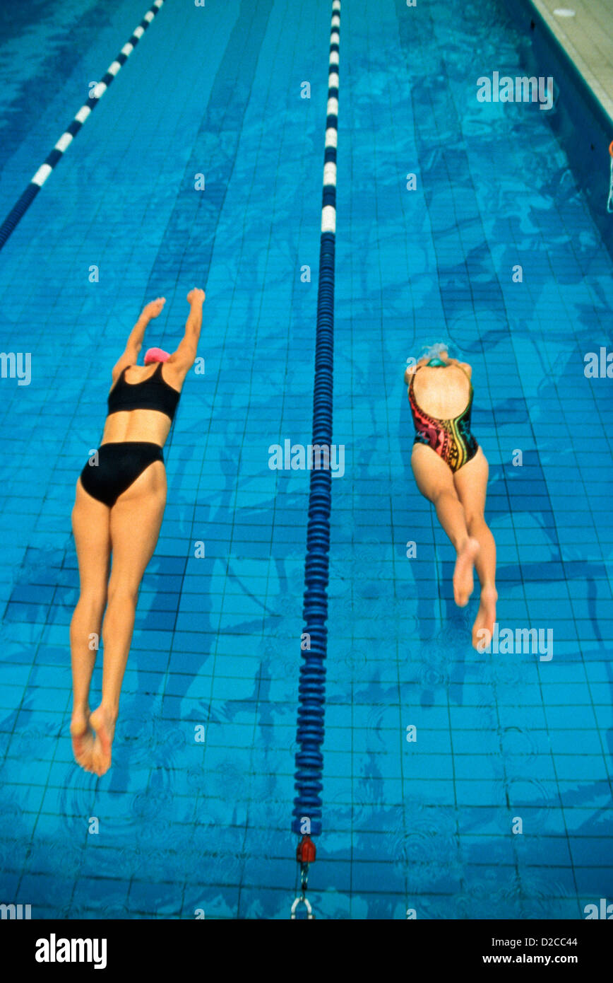 Women Diving Into Pool At Start Of Race Stock Photo Alamy