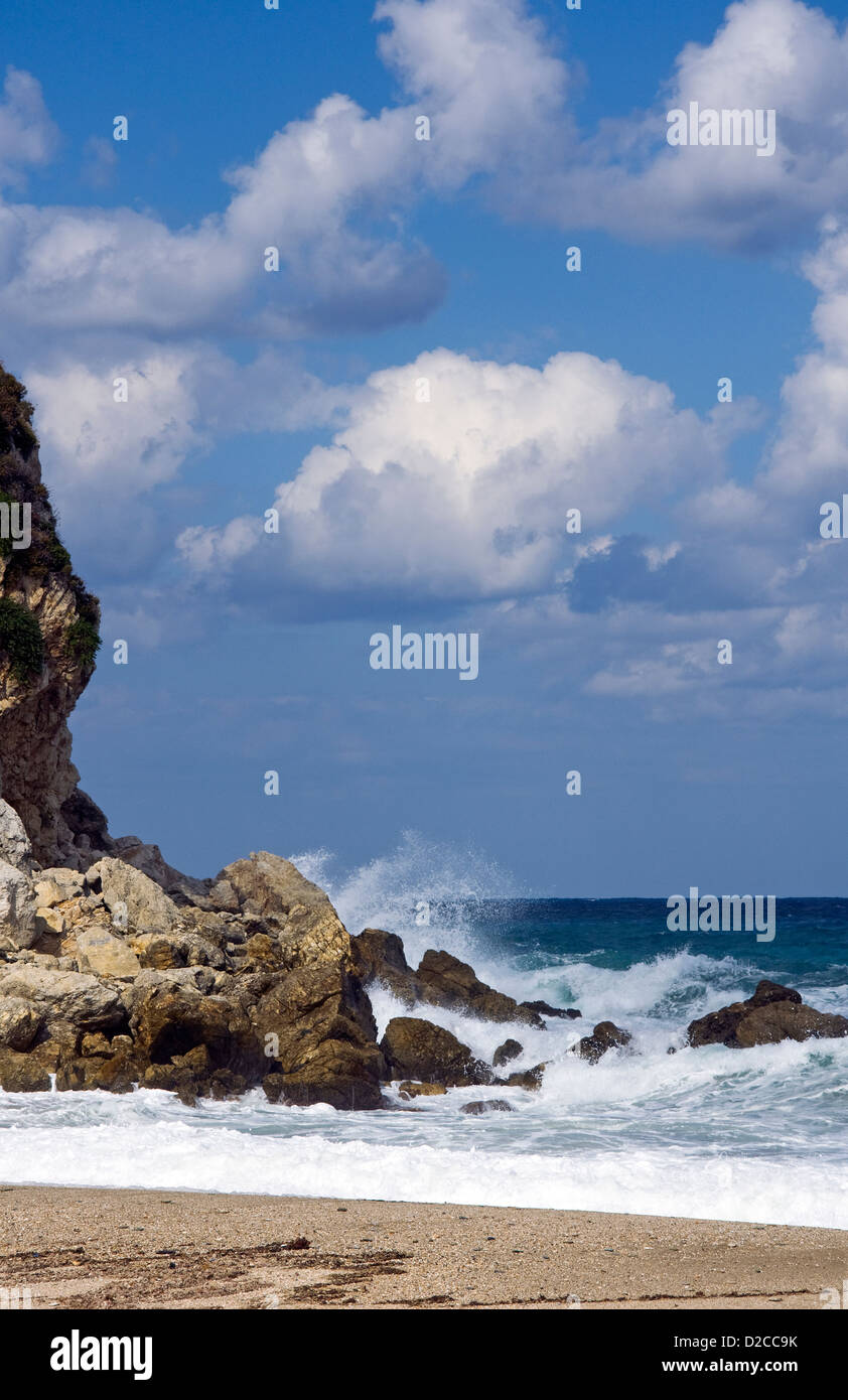 Waves breaking on rocky beach Stock Photo