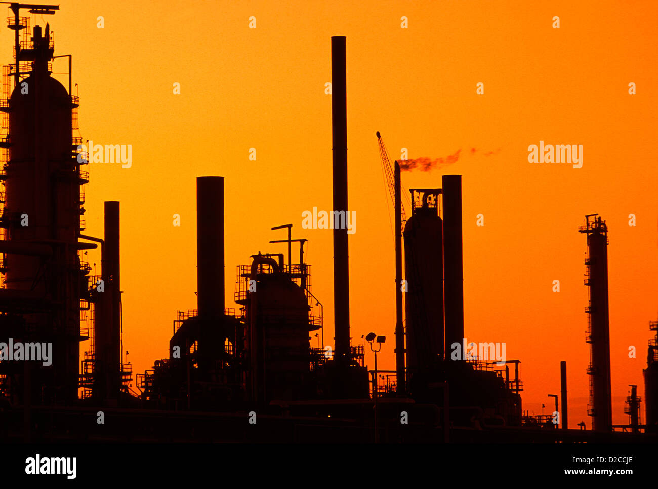 Oil Gas Refinery, Silhouetted At Sunset Stock Photo - Alamy