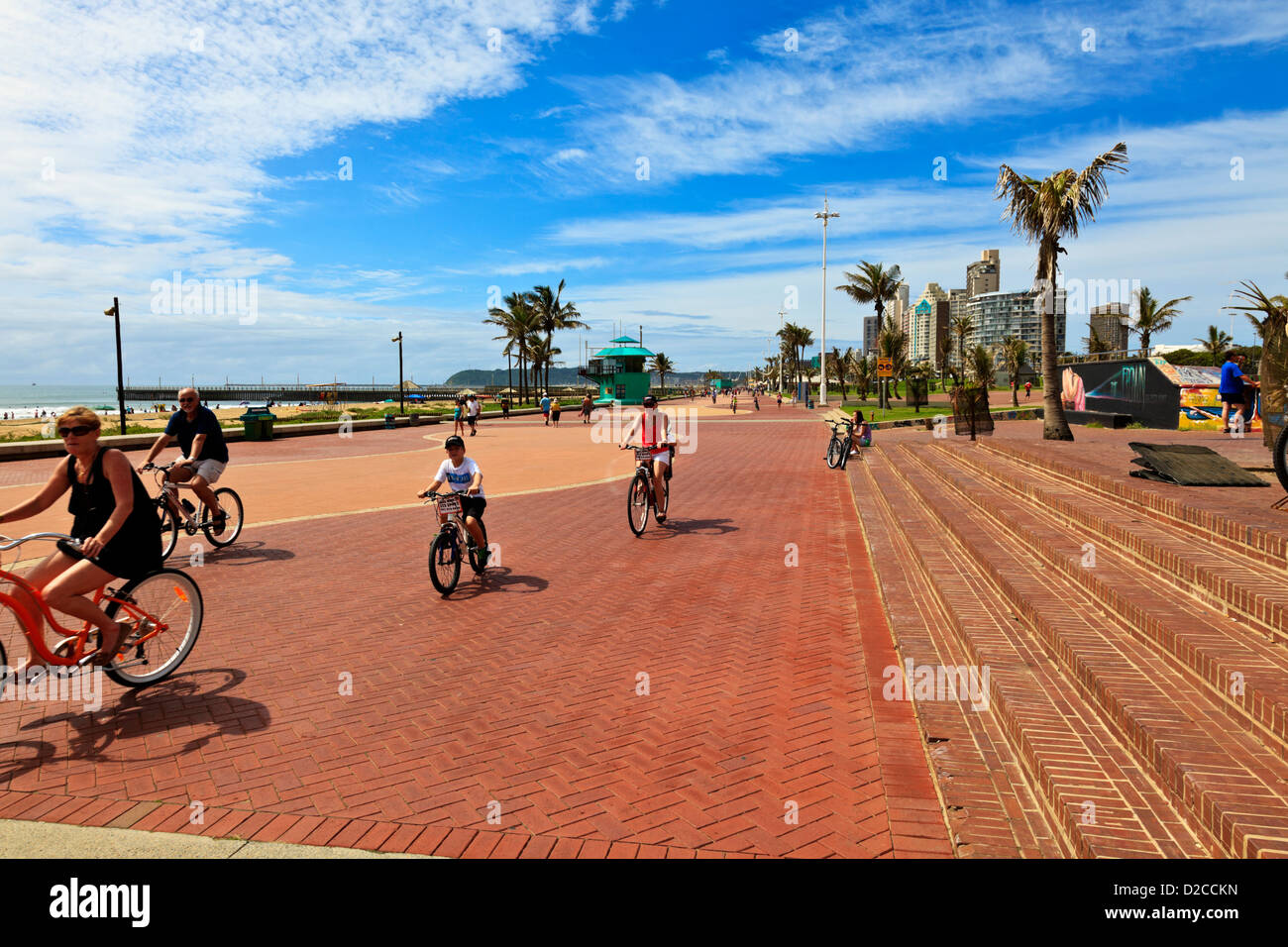 Durban South Africa. A Durban family cycles along the promenade along