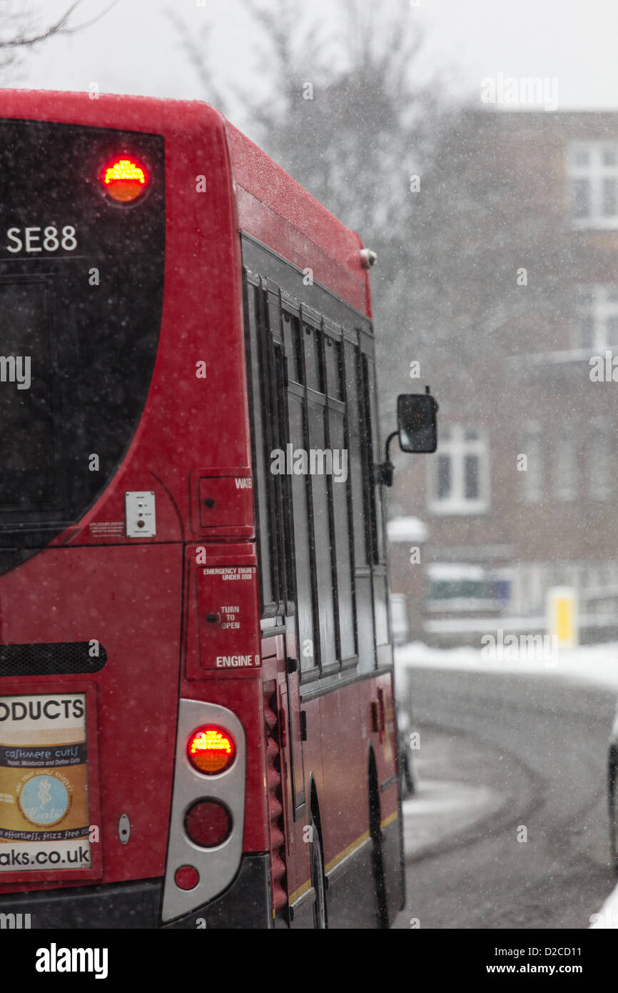 A P5 bus travels along Knatchbull Road, Camberwell, South London, UK on 20 January 2013. This is the third day of snow in the capital and forecasters predict more for later on 20 January. Stock Photo