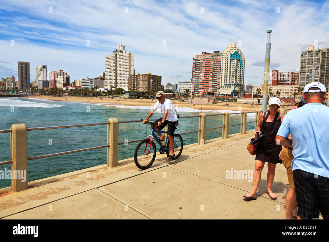Durban, South Africa. People enjoy the outdoors along the pier at Durban's North Beach. Durban South Africa. Stock Photo