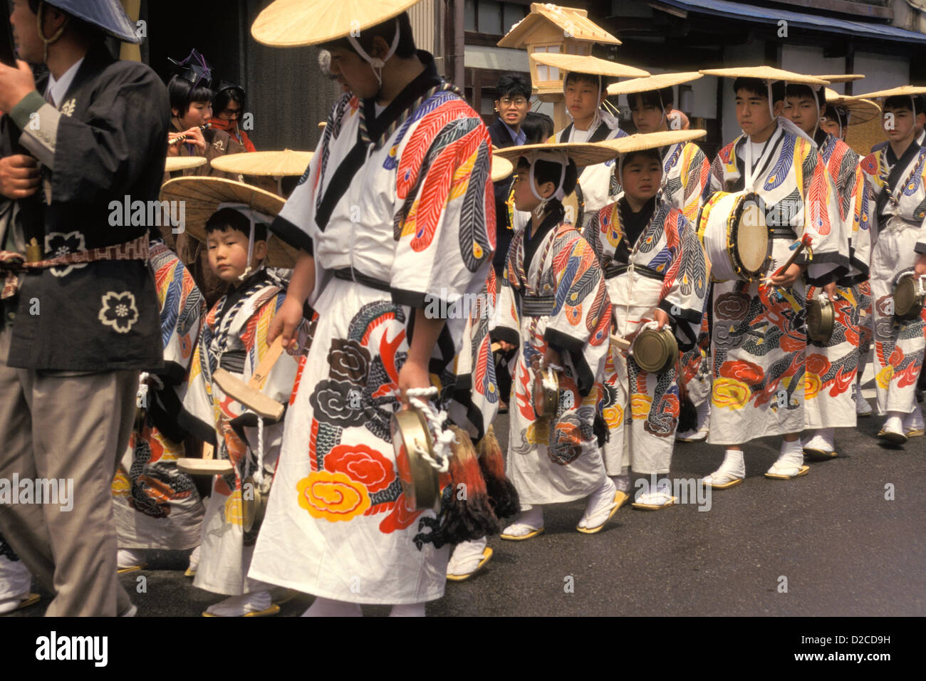 Japan, Takayama. Men And Children In Procession At Festival, With Percussion Instruments. Stock Photo