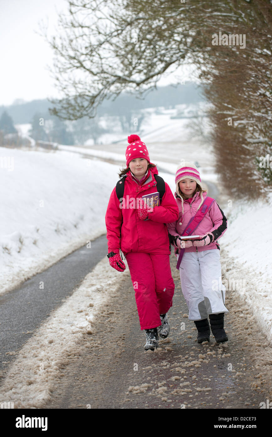 Children walking down a country lane in Winter Stock Photo