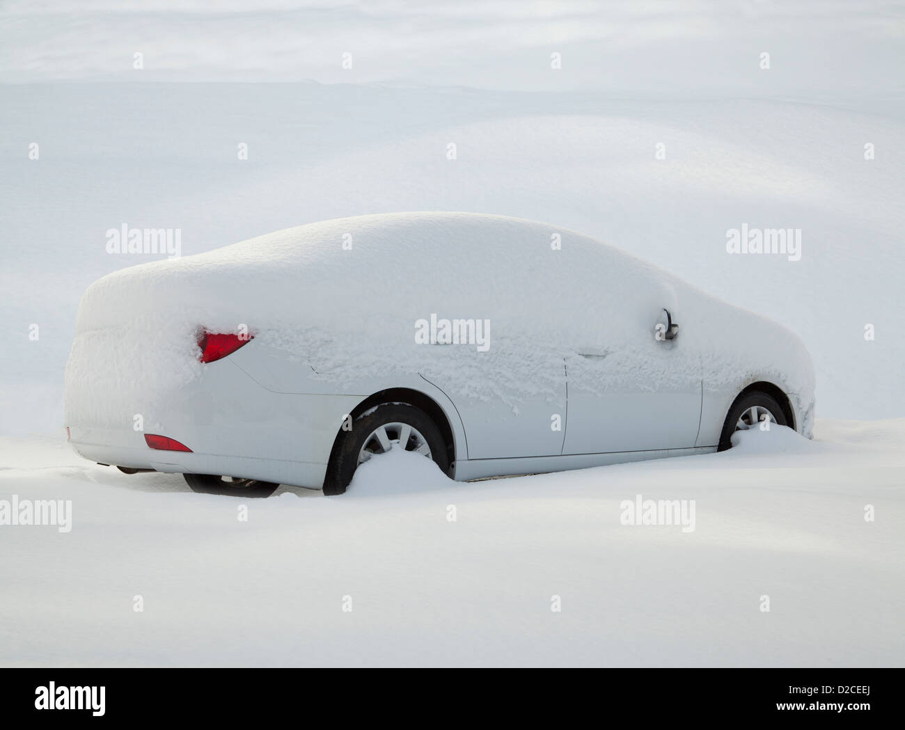 car covered with snow in the forest Stock Photo