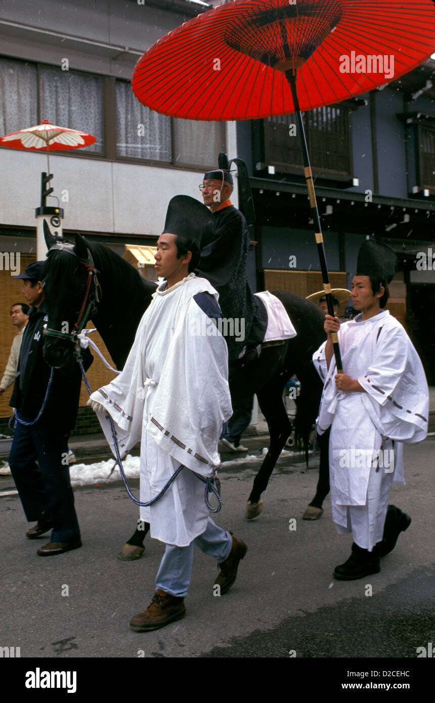 Japan, Takayama. Man On Horse, Being Protected By Red Umbrella, In Festival Procession Stock