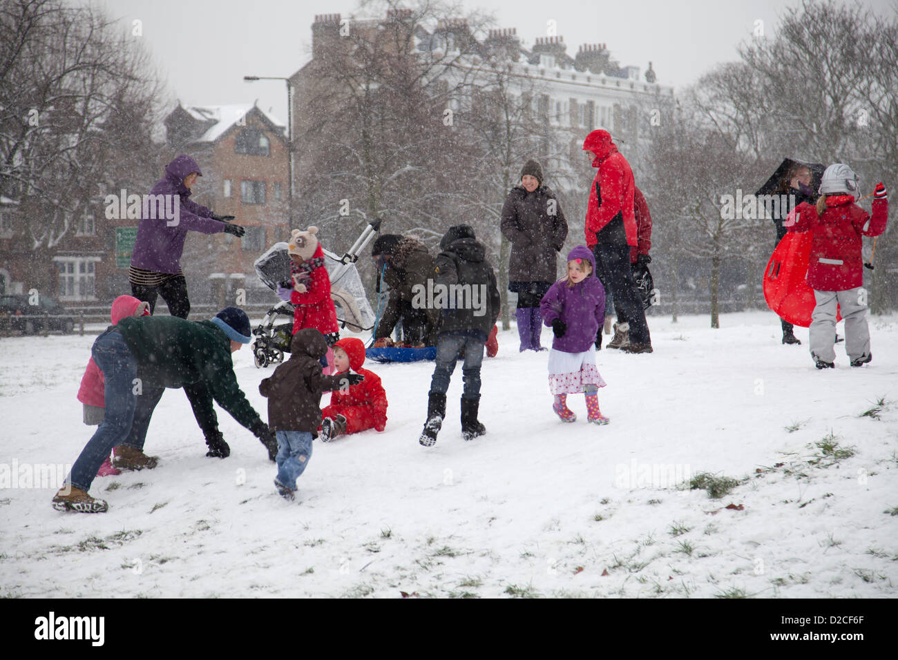 20 January 2013  13.17 PM - Snow falls on Clapham Common in Clapham, London, UK. Children playing in the snow and parents play in the snow on Clapham Common. Stock Photo