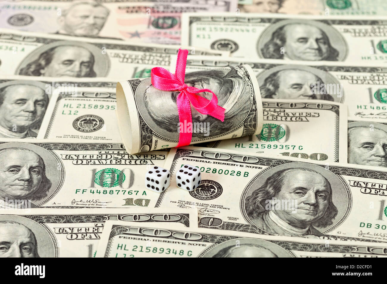 US dollars wrapped by ribbon on money background Stock Photo - Alamy