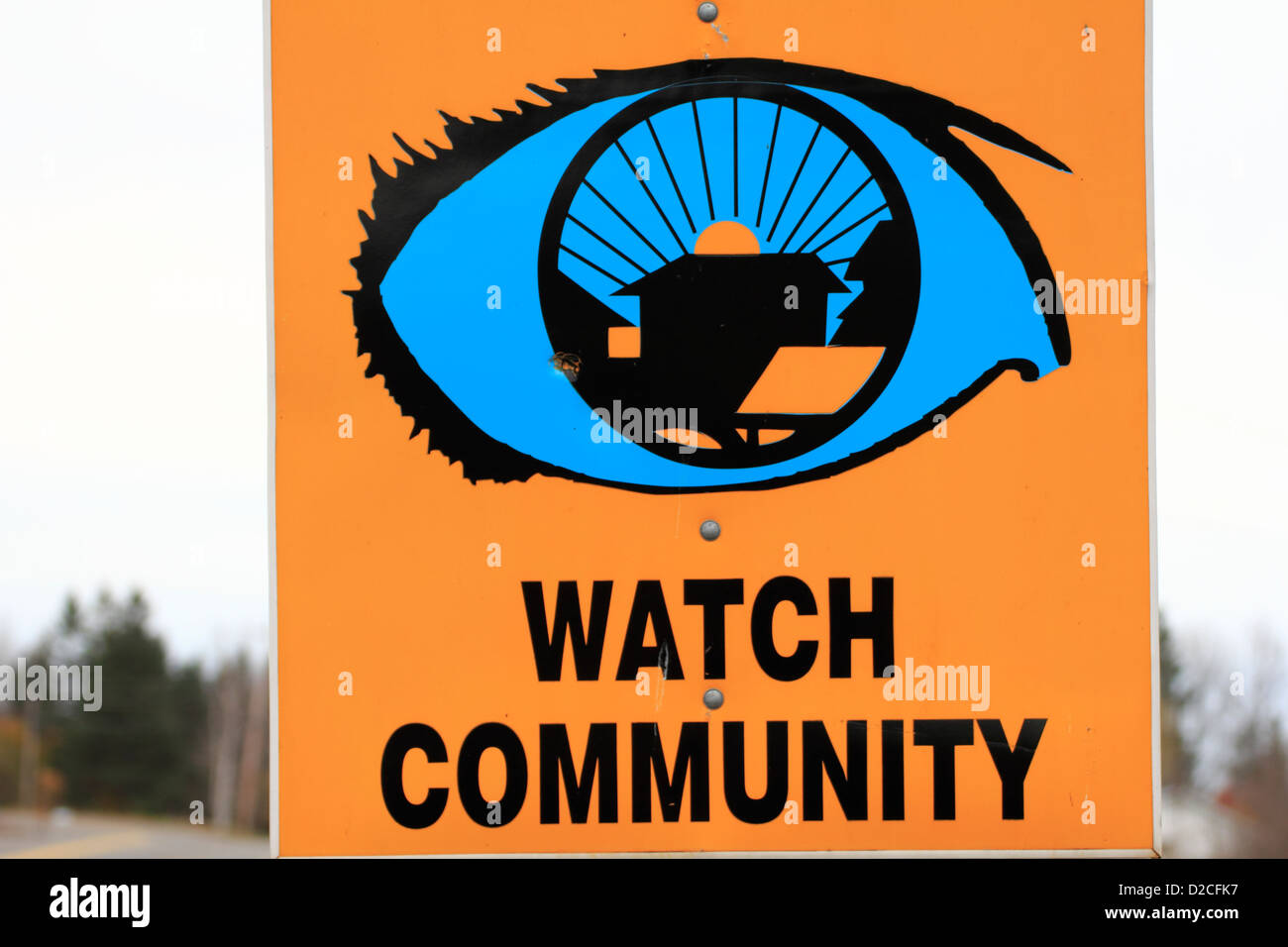 A neighborhood community watch sign beside a road Stock Photo