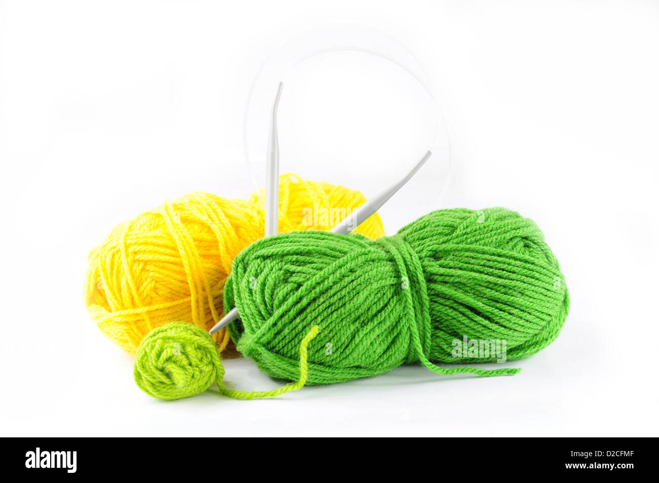 Green and yellow yarn and needles for knitting Stock Photo Alamy