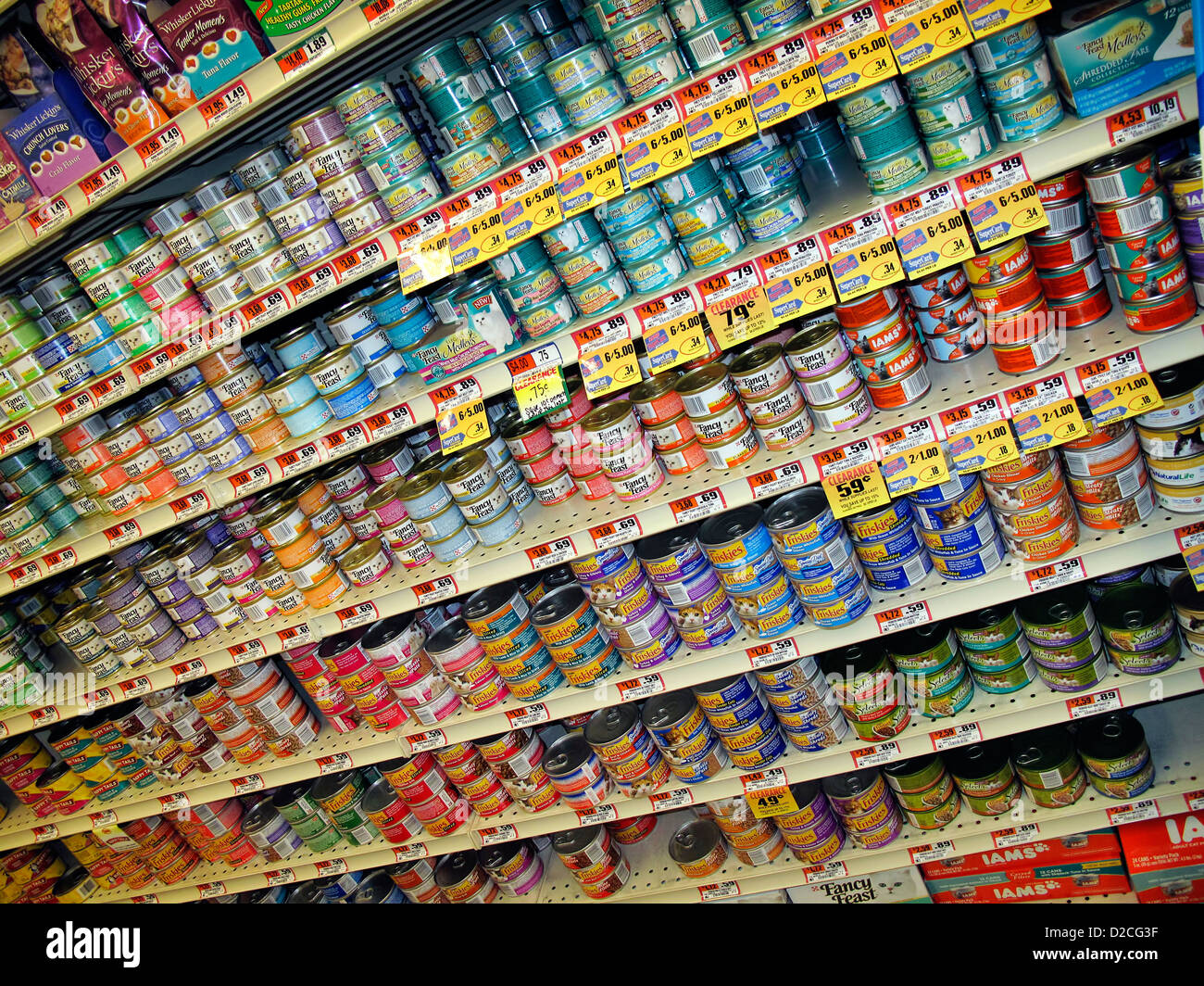 Variety of canned cat food products on a store shelf. Stock Photo