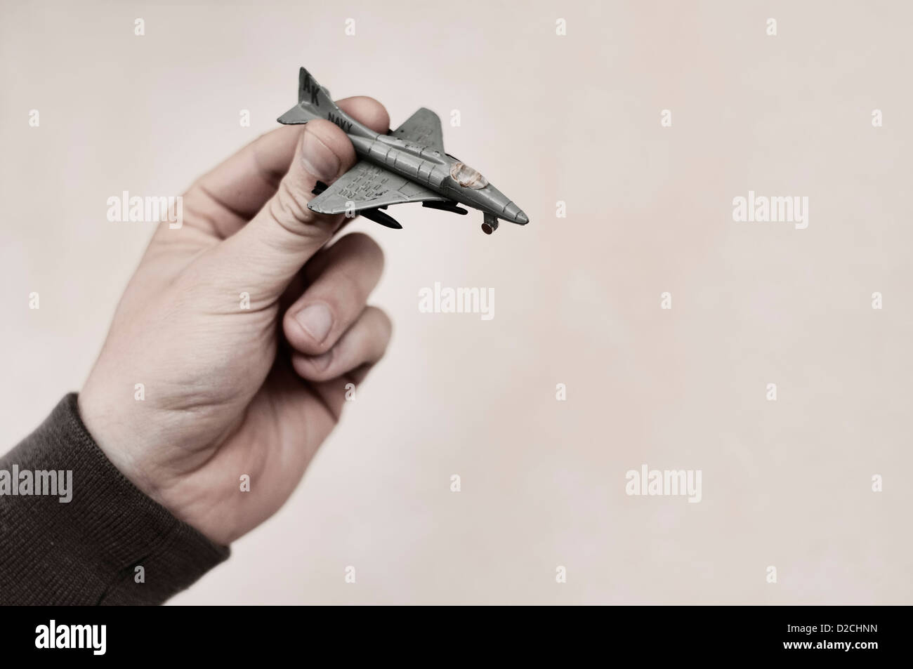 Man holding toy plane Stock Photo