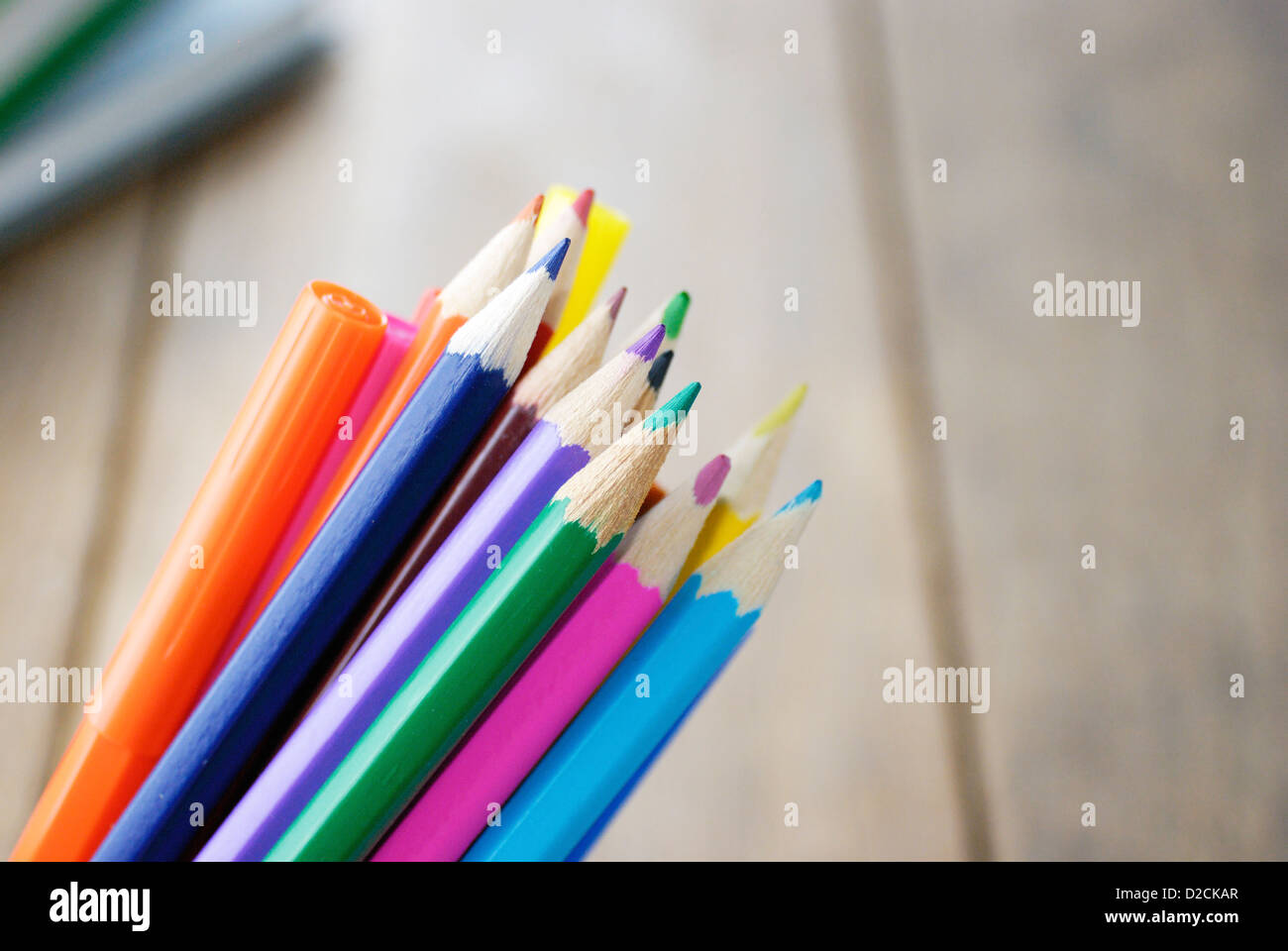 https://c8.alamy.com/comp/D2CKAR/lot-of-the-rainbow-pencils-and-felt-tip-pens-on-the-wooden-table-D2CKAR.jpg