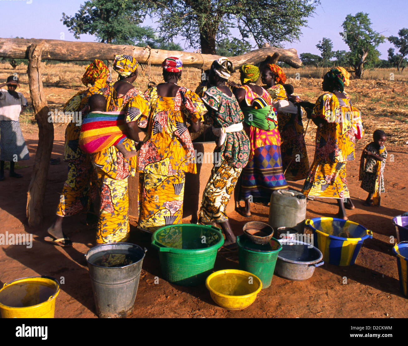 Women drawing water from a well in in Dogon Country, Mali, West Africa. Stock Photo