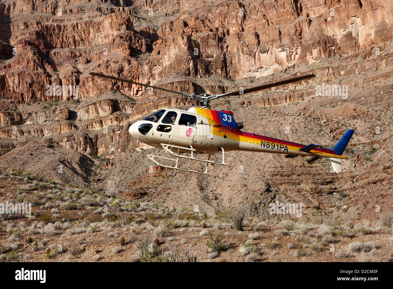 papillon helicopter tours coming in to land pad down in the Grand canyon Arizona USA Stock Photo