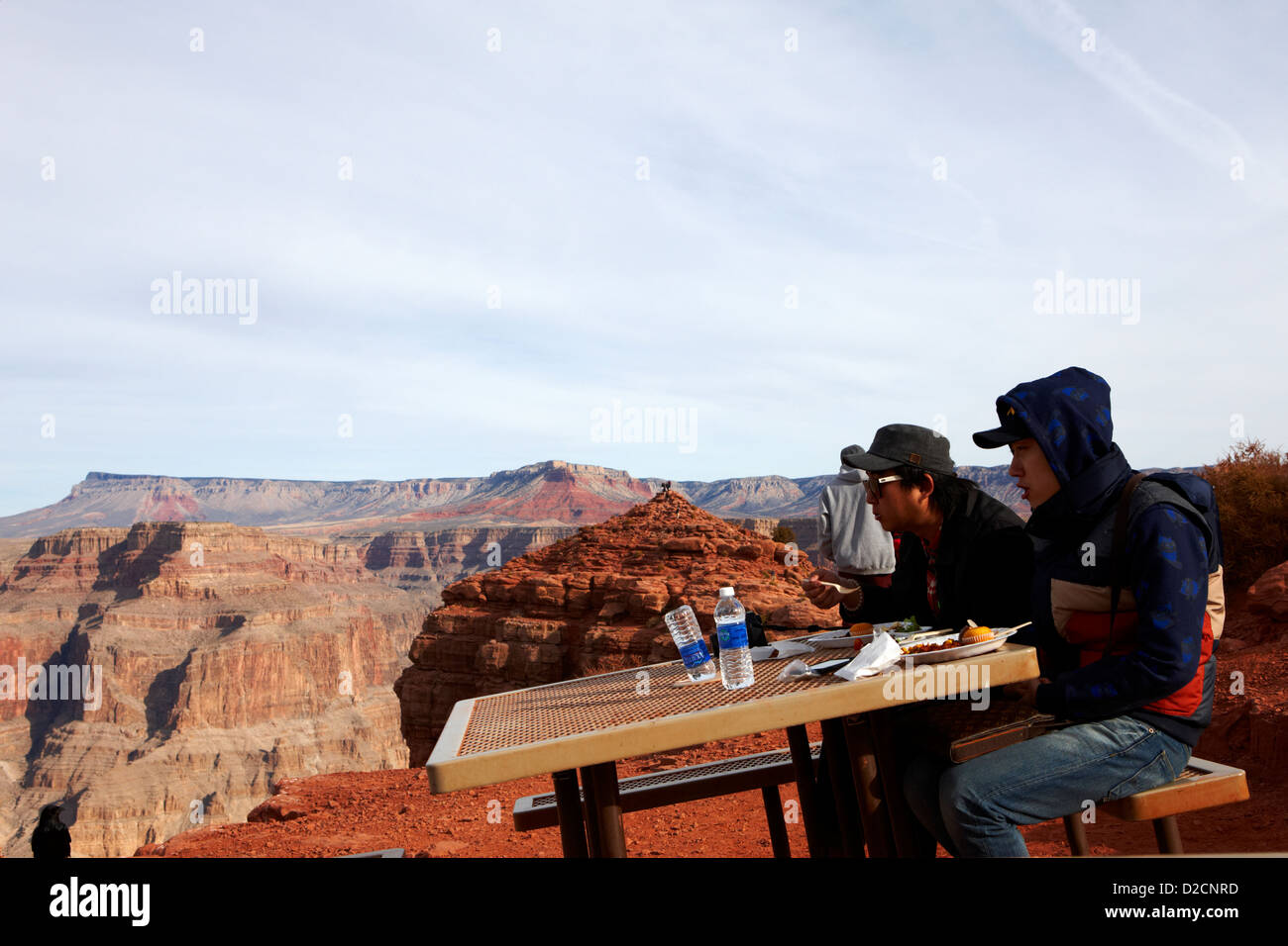 asian tourists enjoying indian buffet food at guano point on the edge of the grand canyon home of the hualapai nation Arizona US Stock Photo