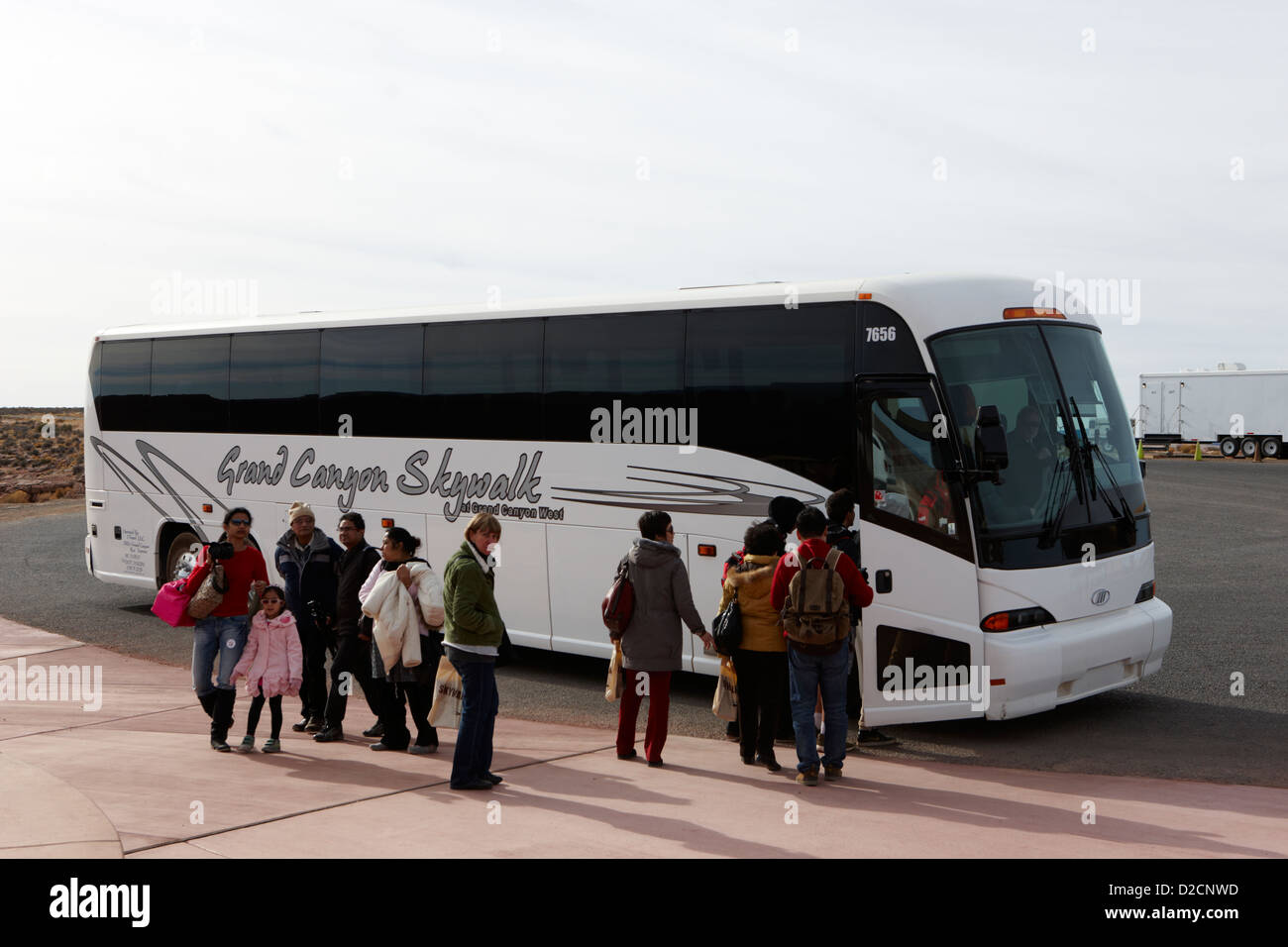 tourists boarding grand canyon skywalk shuttle bus at hualapai nation sign at guano point Arizona USA Stock Photo