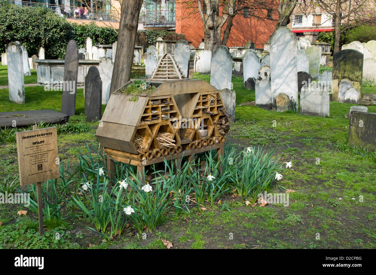 Invertebrate Bug Hotel or Insect House  situated amongst gravestones, Bunhill Fields Burial Ground Stock Photo