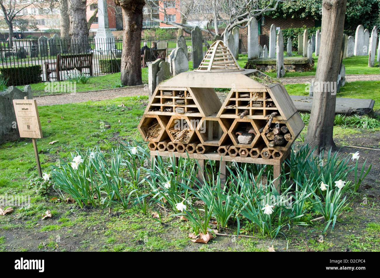 Invertebrate Bug Hotel or Insect House  situated amongst gravestones, Bunhill Fields Burial Ground Stock Photo