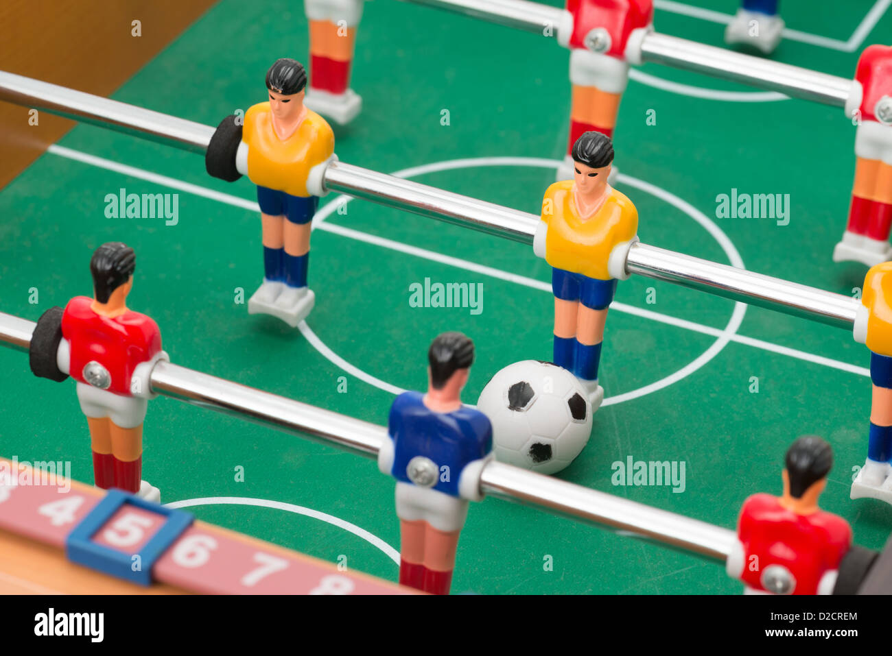 Closeup on the players of a table football game Stock Photo Alamy
