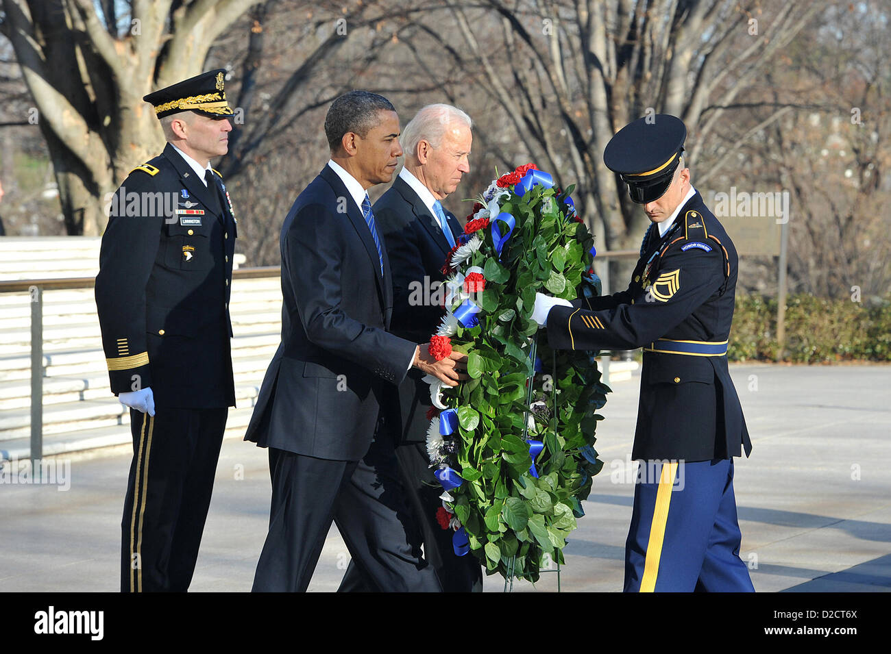 US President Barack Obama and Vice President Joe Biden lay a wreath at the Tomb of the Unknowns January 20, 2013 at Arlington National Cemetery, VA. It is a tradition for the President to honor the Unknown Soldiers on Inauguration Day. Stock Photo