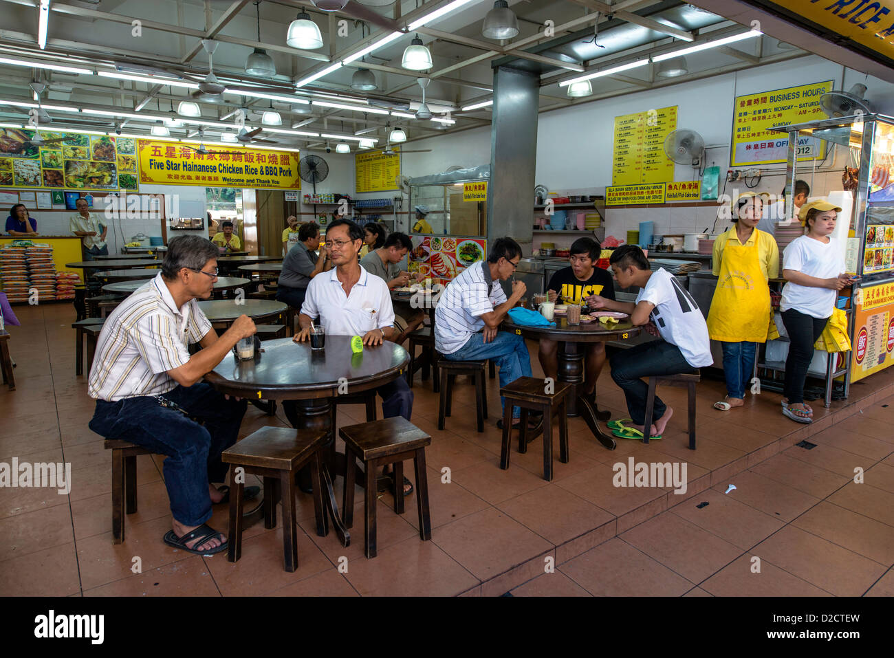 People eating at traditional street food restaurant at local market Kota Kinabalu Sabah Borneo Malaysia Stock Photo