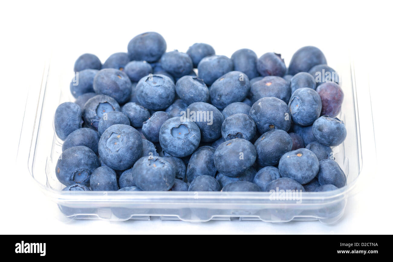 Fresh Blueberries in Plastic Container on white background Stock Photo